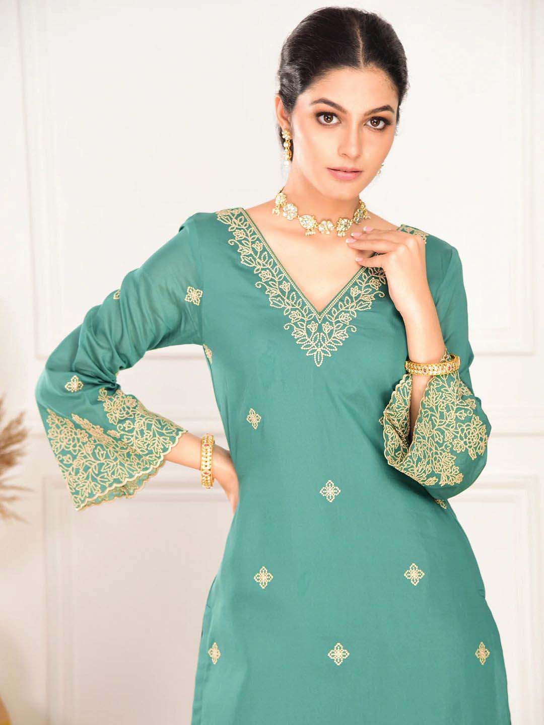 elegant green embroidered suit with graceful dupatta detailing elegant green embroidered suit with graceful dupatta detailing