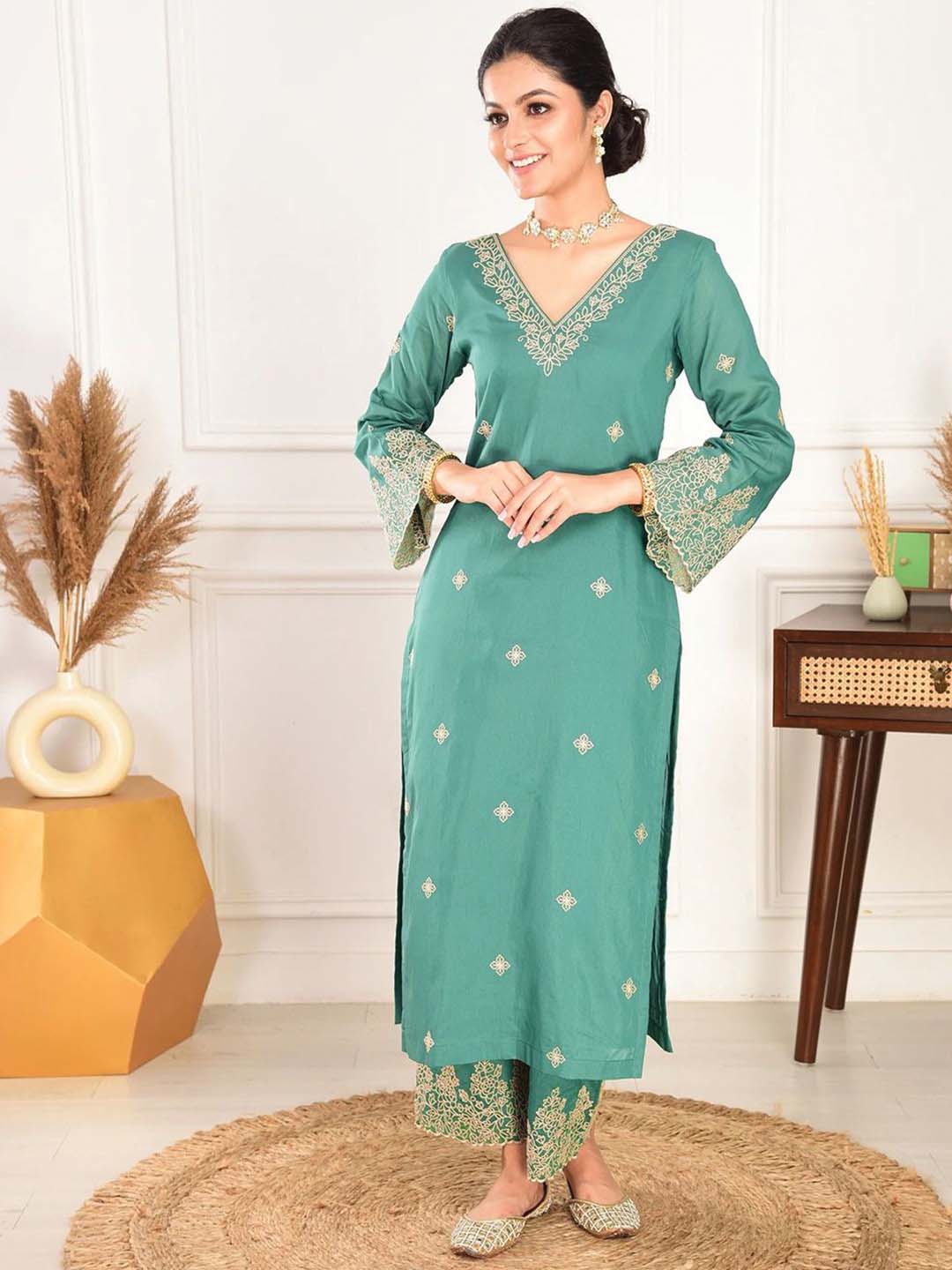 elegant green embroidered suit with graceful dupatta detailing elegant green embroidered suit with graceful dupatta detailing