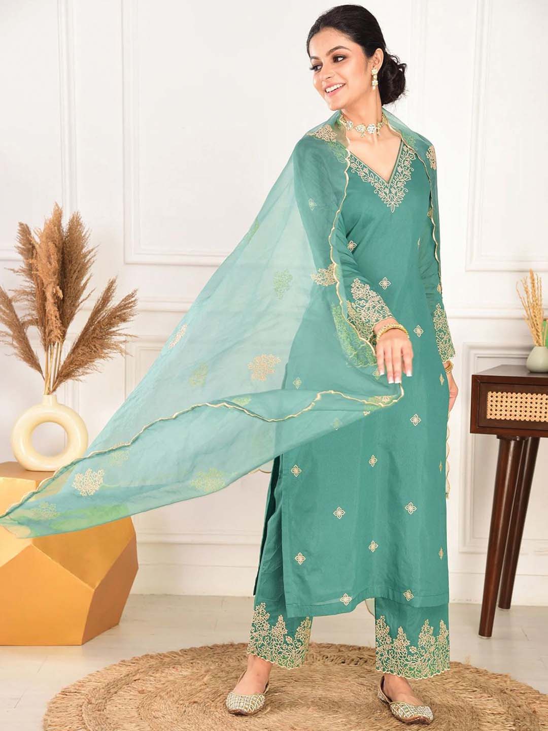elegant green embroidered suit with graceful dupatta detailing elegant green embroidered suit with graceful dupatta detailing