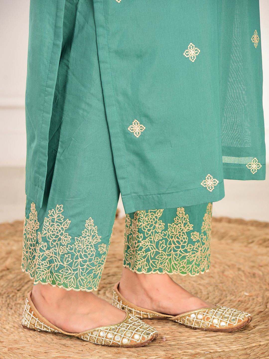 elegant green embroidered suit with graceful dupatta detailing elegant green embroidered suit with graceful dupatta detailing